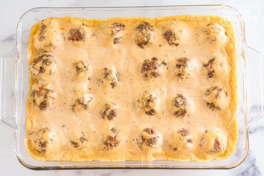 Baked meatballs with cream sauce in a baking dish