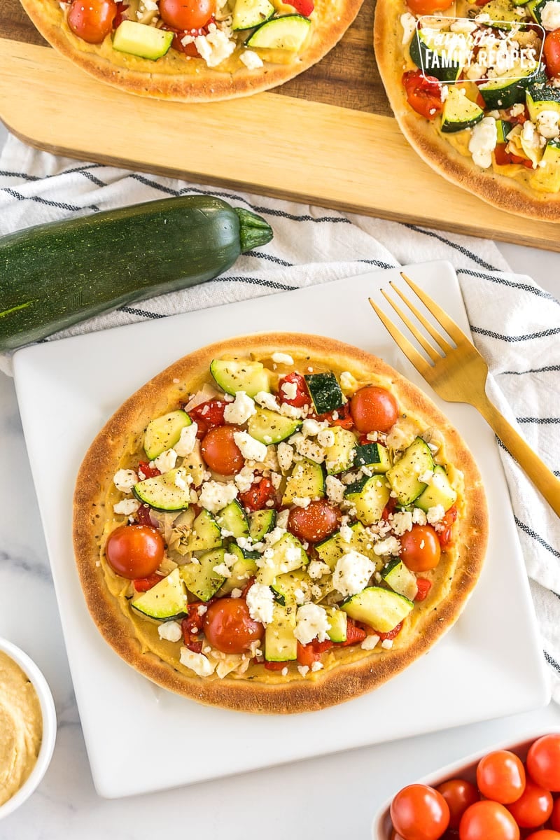 A Mediterranean flatbread pizza on a plate