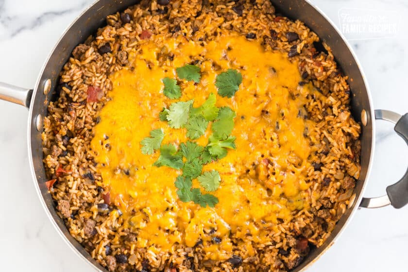 Mexican Beef and Rice Skillet topped with cheese and cilantro
