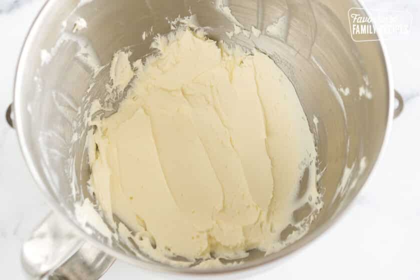 butter and cream cheese beaten together in a mixing bowl
