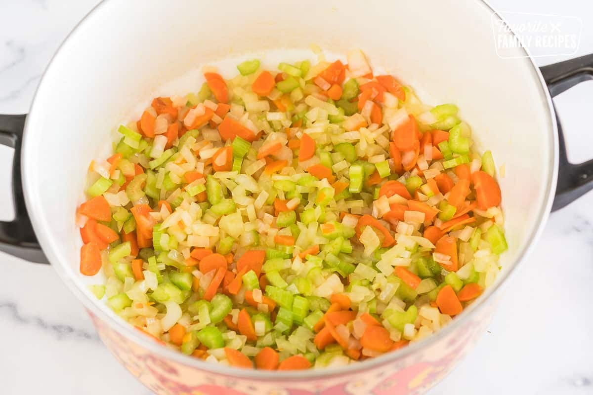 A mirepoix cooking in a pot