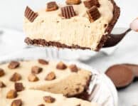Holding up a slice of Peanut Butter Pie on a spatula.