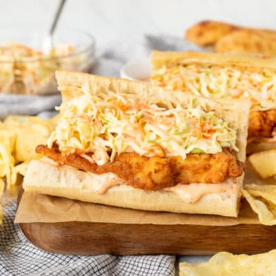 Cajun Fried Chicken Po'Boys with dressing and coleslaw.