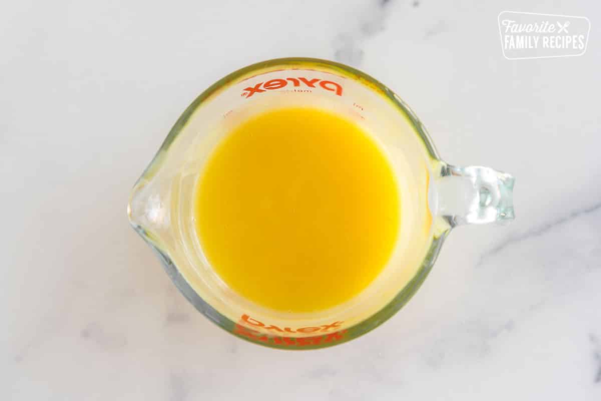 Tempered egg yolks in a glass measuring cup