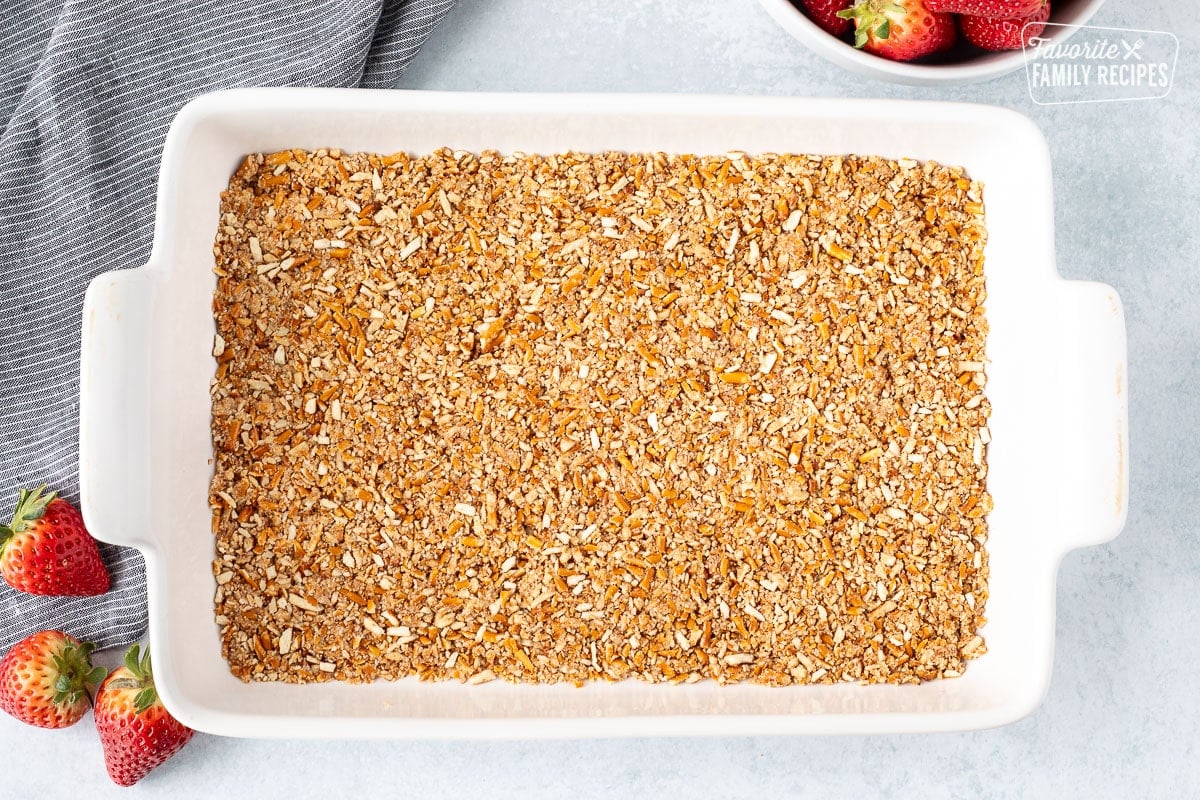 Baking dish with pressed pretzel crust.