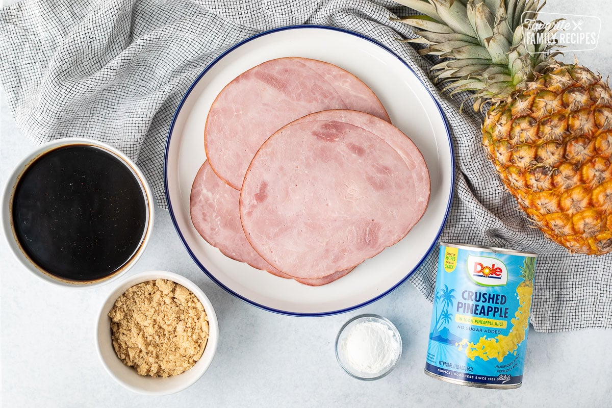 Ingredients to make Sweet Teriyaki Ham Steaks including crushed pineapple, corn starch, ham steaks, brown sugar and teriyaki sauce.