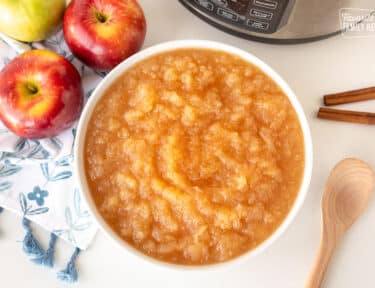 Large bowl of Instant Pot Applesauce sprinkled with cinnamon.