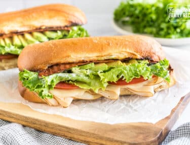 A Turkey Bacon Avocado Sandwich on a cutting board