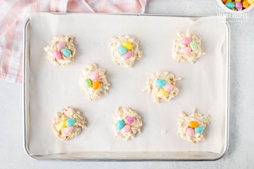 Cookie sheet with jelly beans on top of White Chocolate Bird Nests.