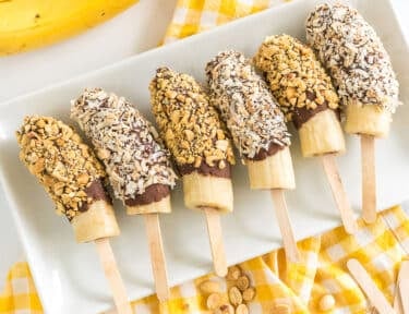 chocolate covered bananas on a plate