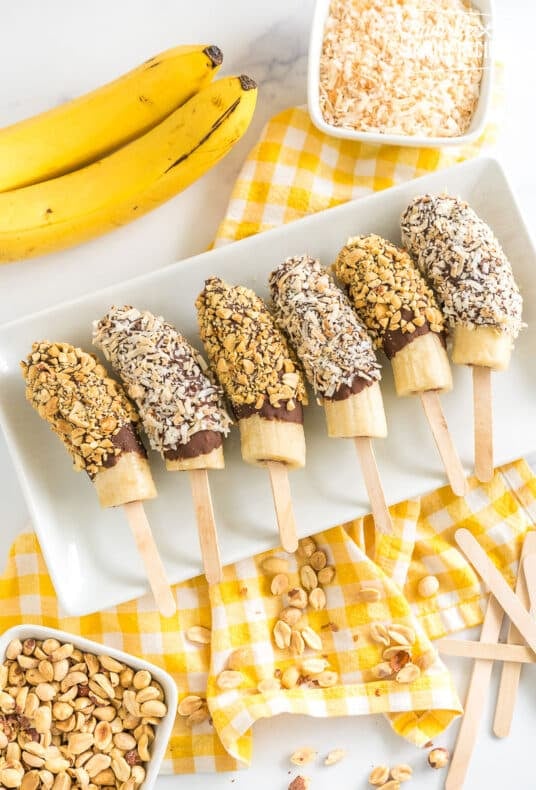 chocolate covered bananas on a plate