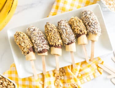 chocolate covered bananas on a plate