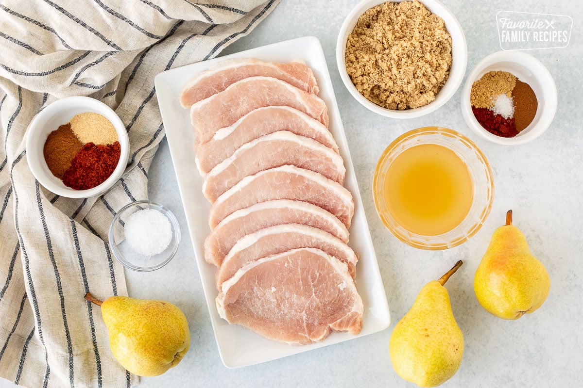 Ingredients to make Grilled Pork Chops with Spiced Pears including thin pork chops, brown sugar, spices, apple cider vinegar, pears and salt.