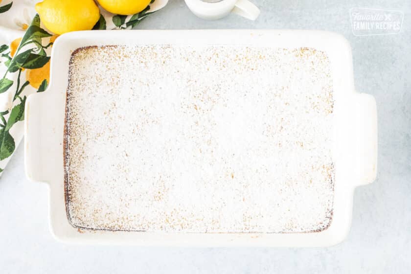 Baked pan of Lemon Bars with powdered sugar.