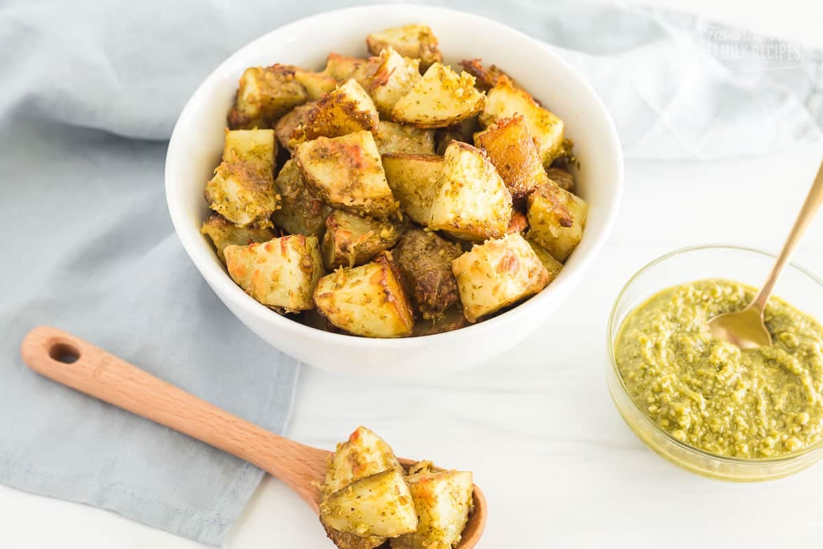 A bowl and spoonful of pesto potatoes