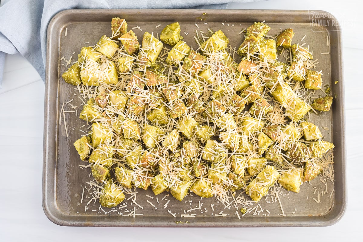 pesto potatoes sprinkled with parmesan before cooking