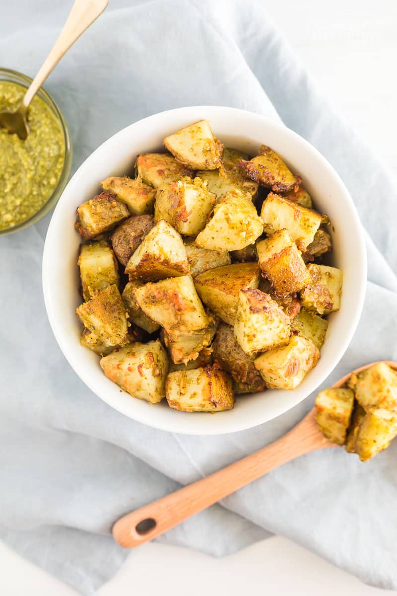 A bowl and spoonful of pesto potatoes