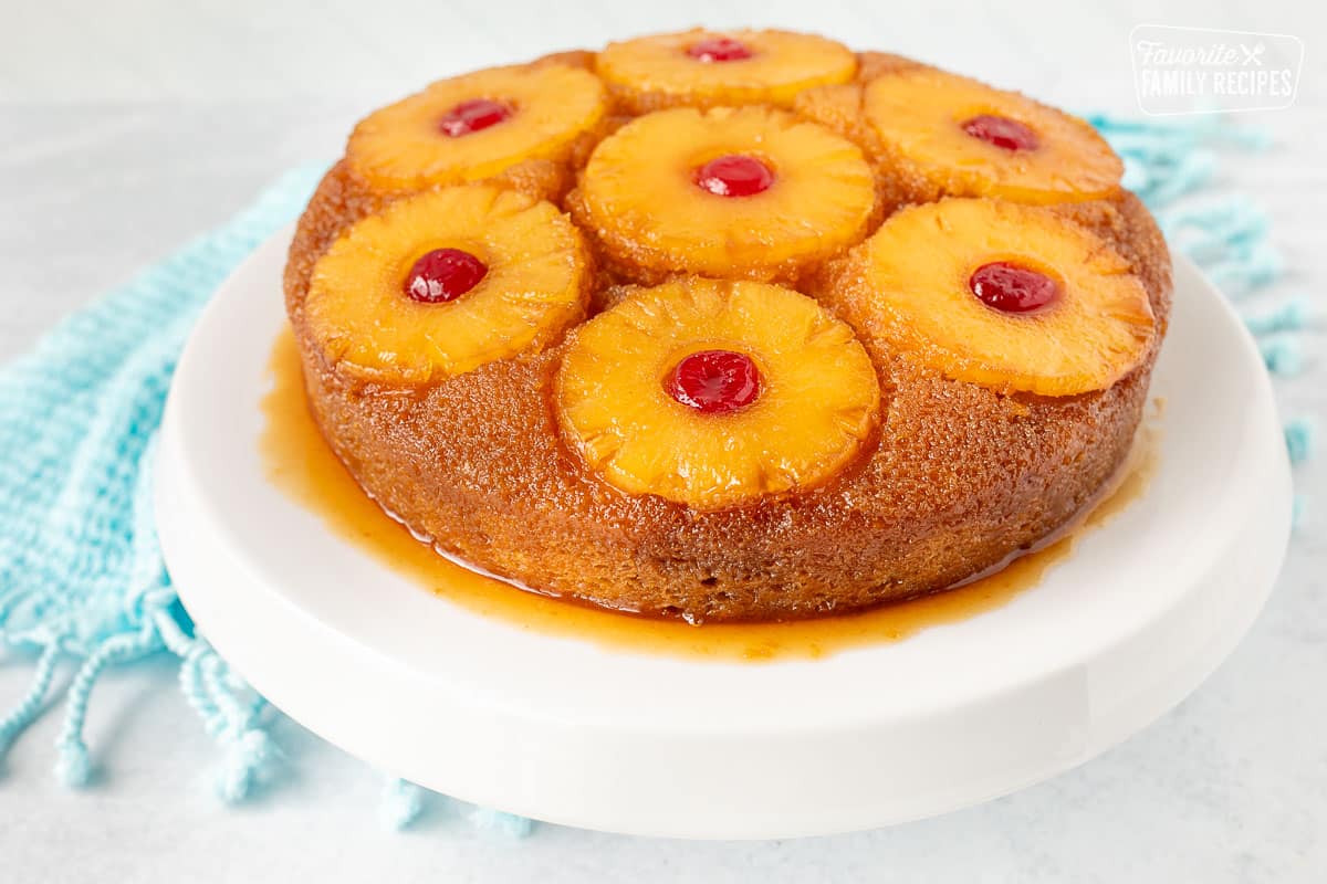 Pineapple Upside Down Cake on a cake stand.