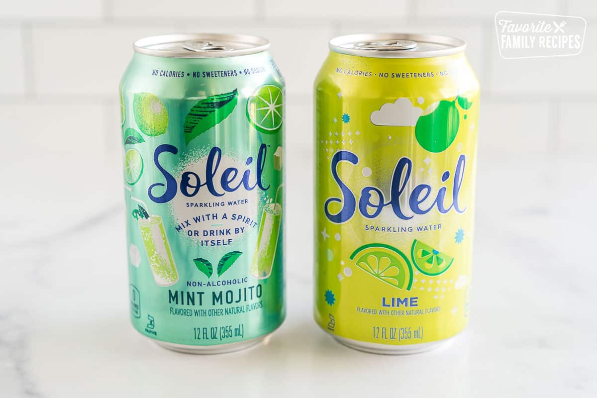 Two cans of flavored sparkling water.