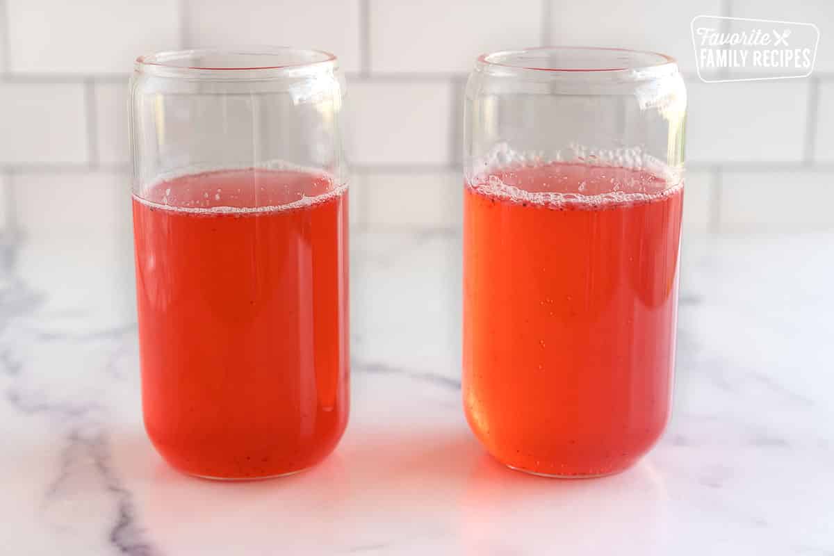 two glasses full of pink liquid