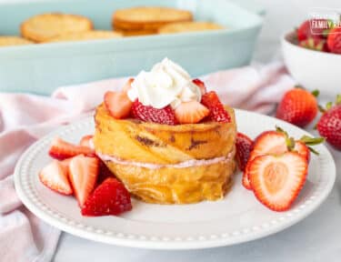 Strawberry French Toast topped with strawberries and whipped cream.