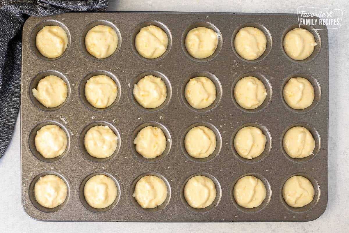 Mini muffin pan with unbaked Brazilian Cheese Bread.