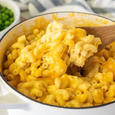 Wooden spoon with Homemade Mac and cheese.