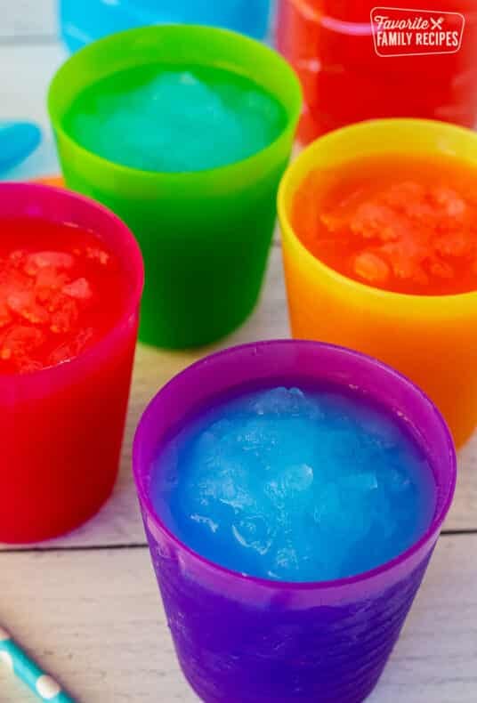 Cups of blue and pink slushie.