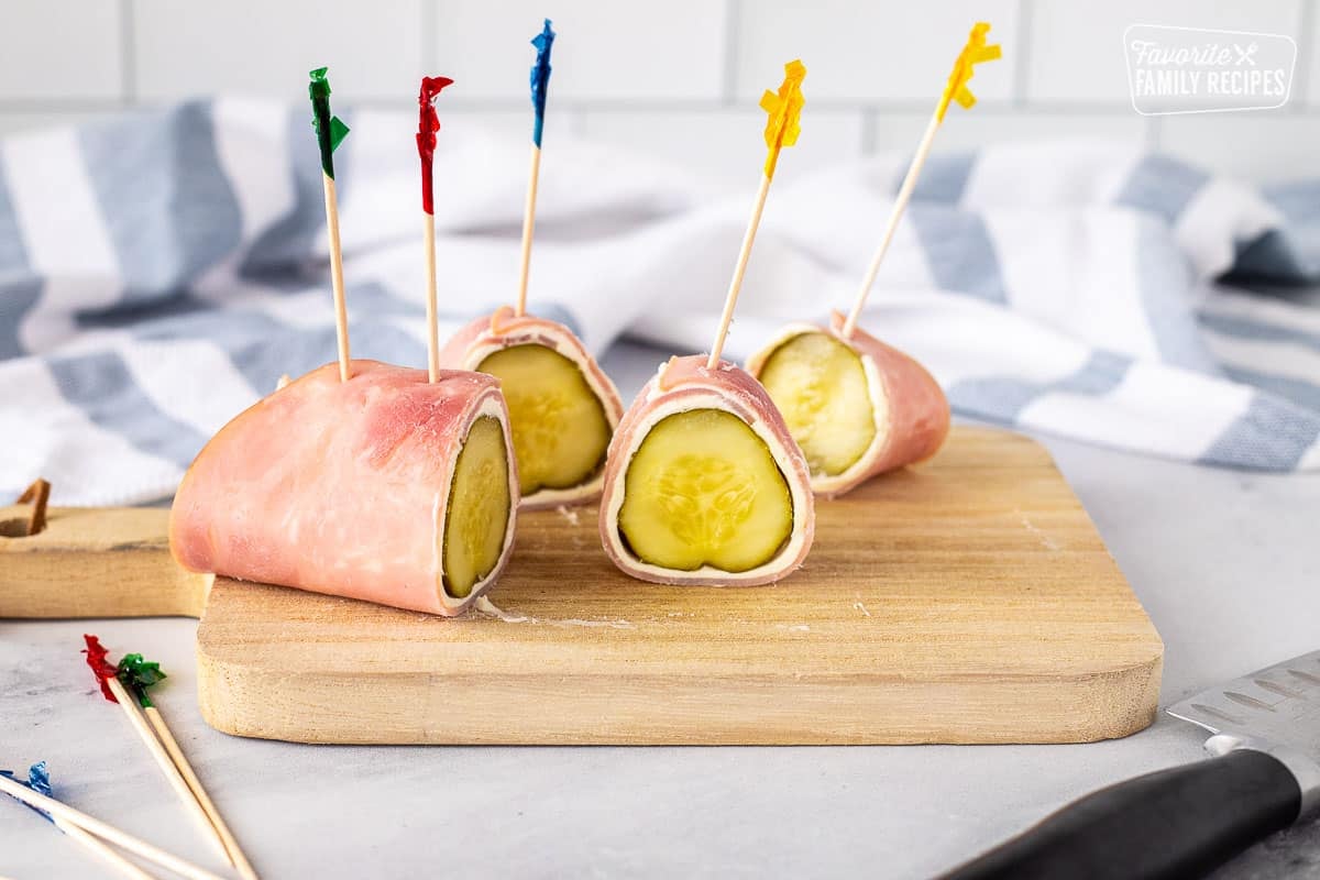 Slicing Ham Roll Up with Pickle.