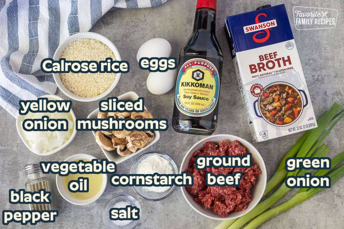 Ingredients to make Loco Moco including eggs, soy sauce, beef broth, ground beef, green onions, corn starch, salt, pepper, oil, onion, mushrooms and rice.