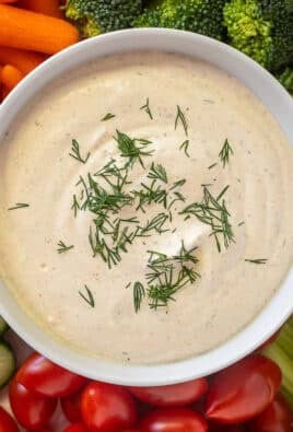 Bowl of Veggie Dip surrounded by fresh vegetables.