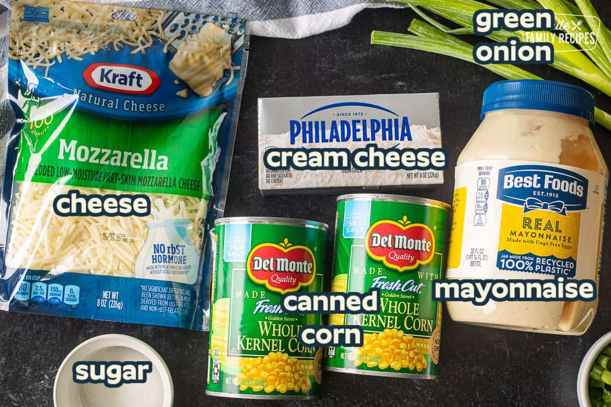 Ingredients to make Corn Cheese including mayo, whole kernel corn cans, cream cheese, mozzarella cheese, sugar and green onion.