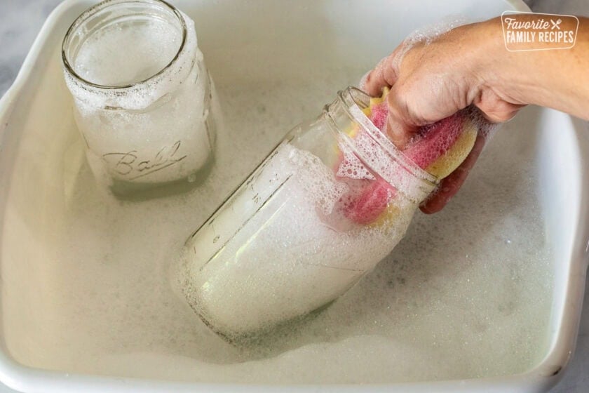 Washing out canning jars.