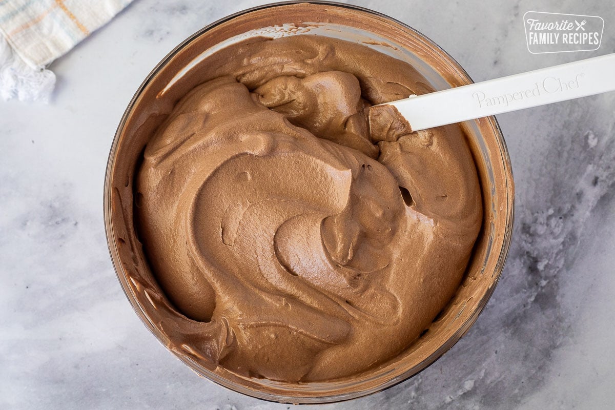 Glass bowl of Chocolate Satin Pie filling and a spatula.