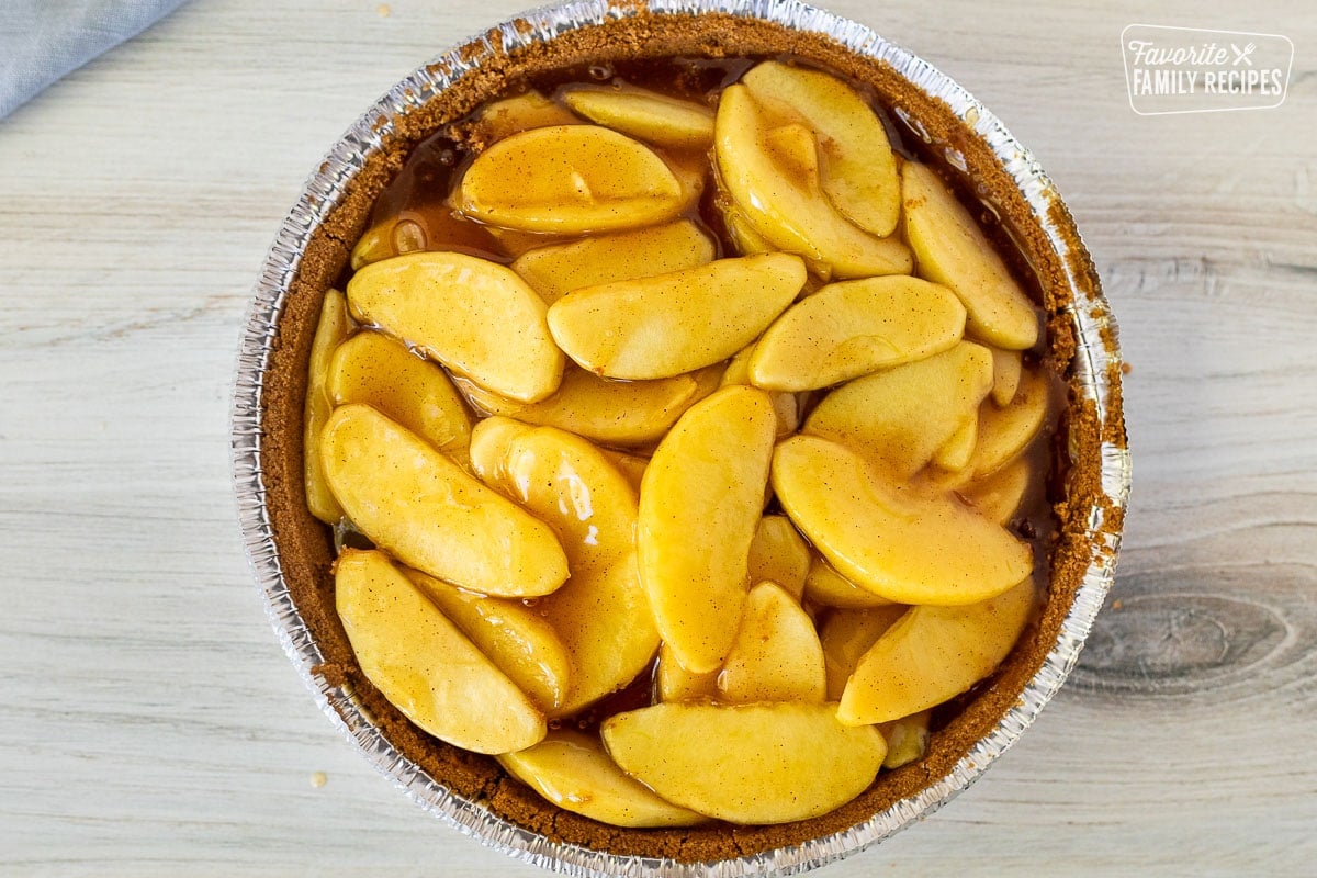 Graham cracker pie tin filled with Gluten Free Apple Pie filling.