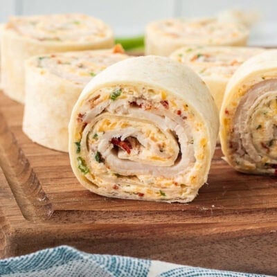 A close up vertical image of a turkey pinwheel showing the spiral in the center