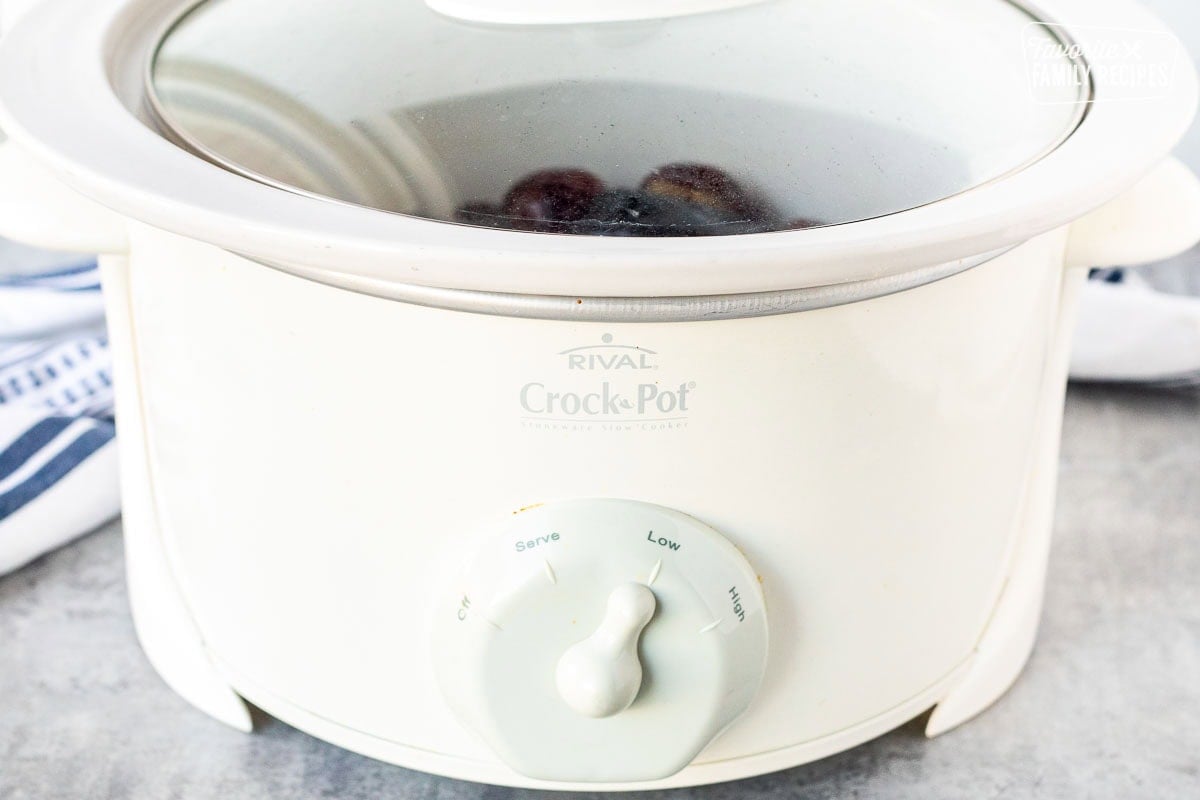 Crockpot cooking grape jelly meatballs on low.