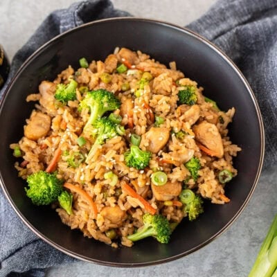 One Pot Teriyaki Chicken Bowls with broccoli, carrots, chicken, peas and green onion.