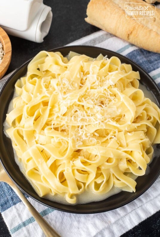 Plate of Authentic Fettuccine Alfredo with fresh grated Parmigiana Reggiano cheese.