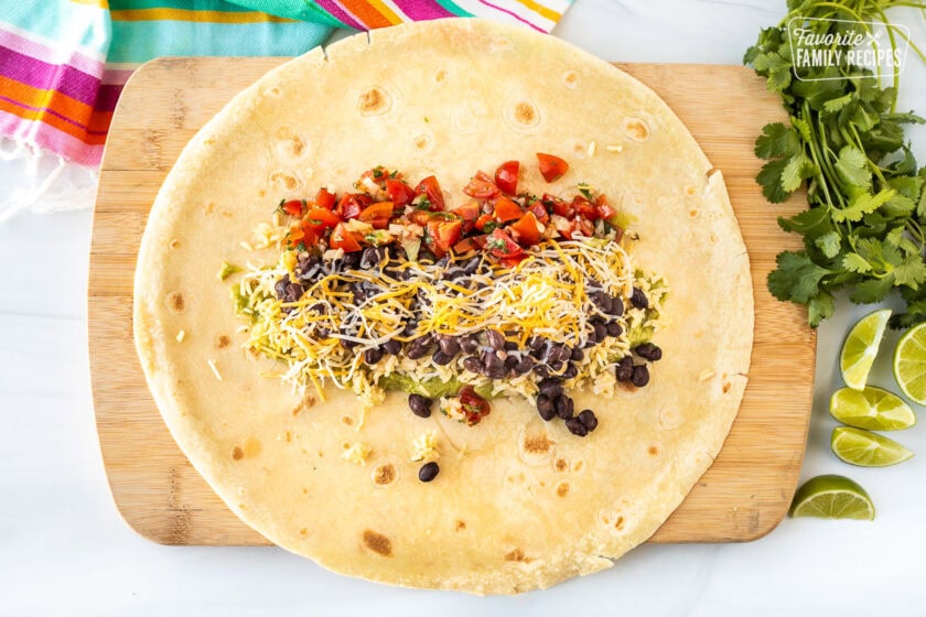 Large flour tortilla with guacamole, cilantro lime rice, black beans, pico de Gallo and shredded cheese.