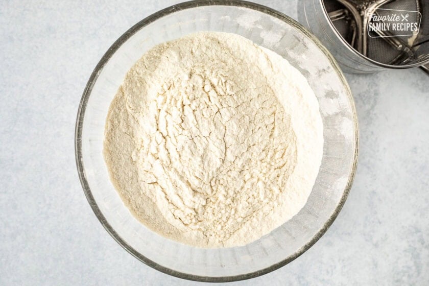 Sifted dry ingredients in a glass bowl.