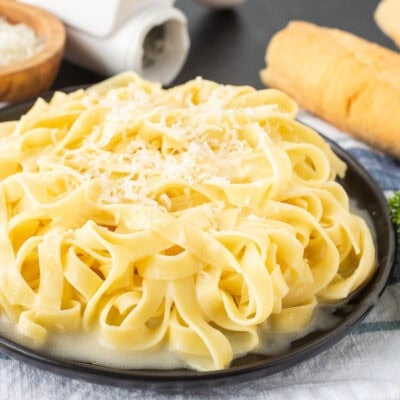 Plate of Authentic Fettuccine Alfredo with fresh grated Parmigiana Reggiano cheese.