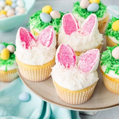Easter cupcakes with marshmallow bunny ears and green coconut Cadbury egg bird nests.