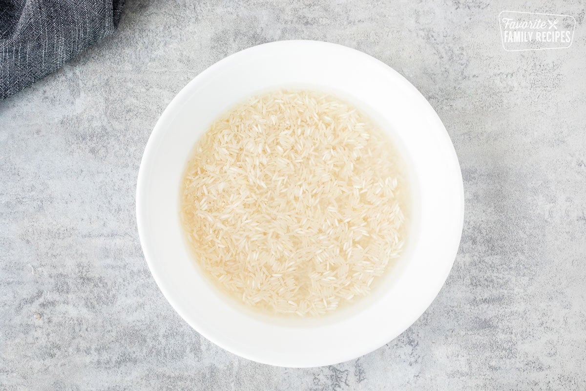 Bowl of rice soaking in water.