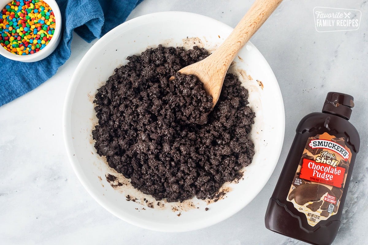 Mixing bowl with magic shell chocolate fudge and crushed Oreo cookies.