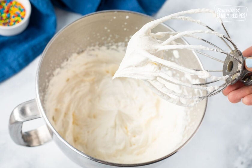 Stabilized whipped cream on a whisk attachment.