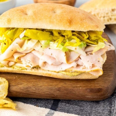 Italian turkey sandwich with pesto mayo, cheese, turkey, peppers and lettuce.