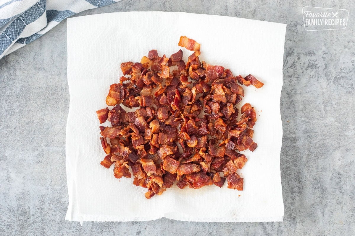 Chopped crispy bacon on paper towels.