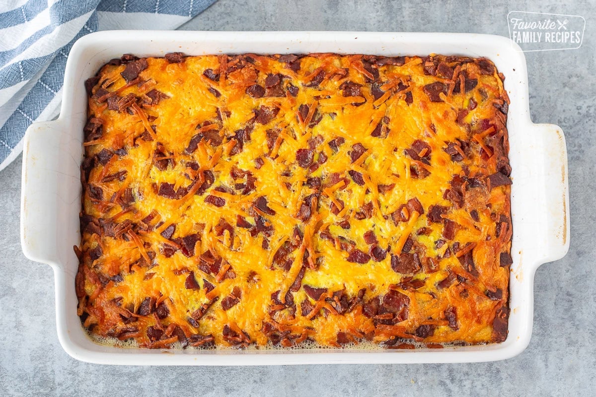 Baked tater tot breakfast casserole and a baking dish.