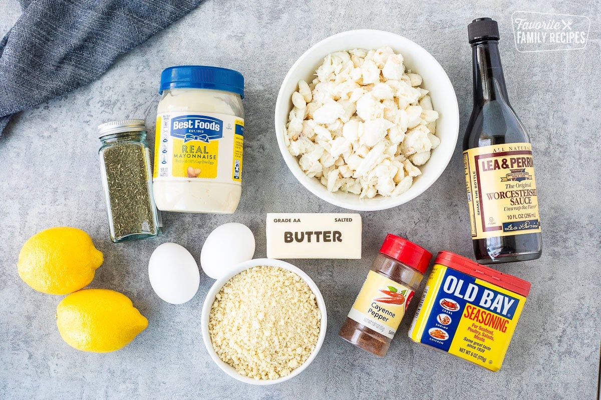 Ingredients to make crab cakes including Worcestershire sauce, old bay seasoning, Cayenne pepper, Panko breadcrumbs, butter, eggs, lemon, lump crab, dried dill and mayonnaise.